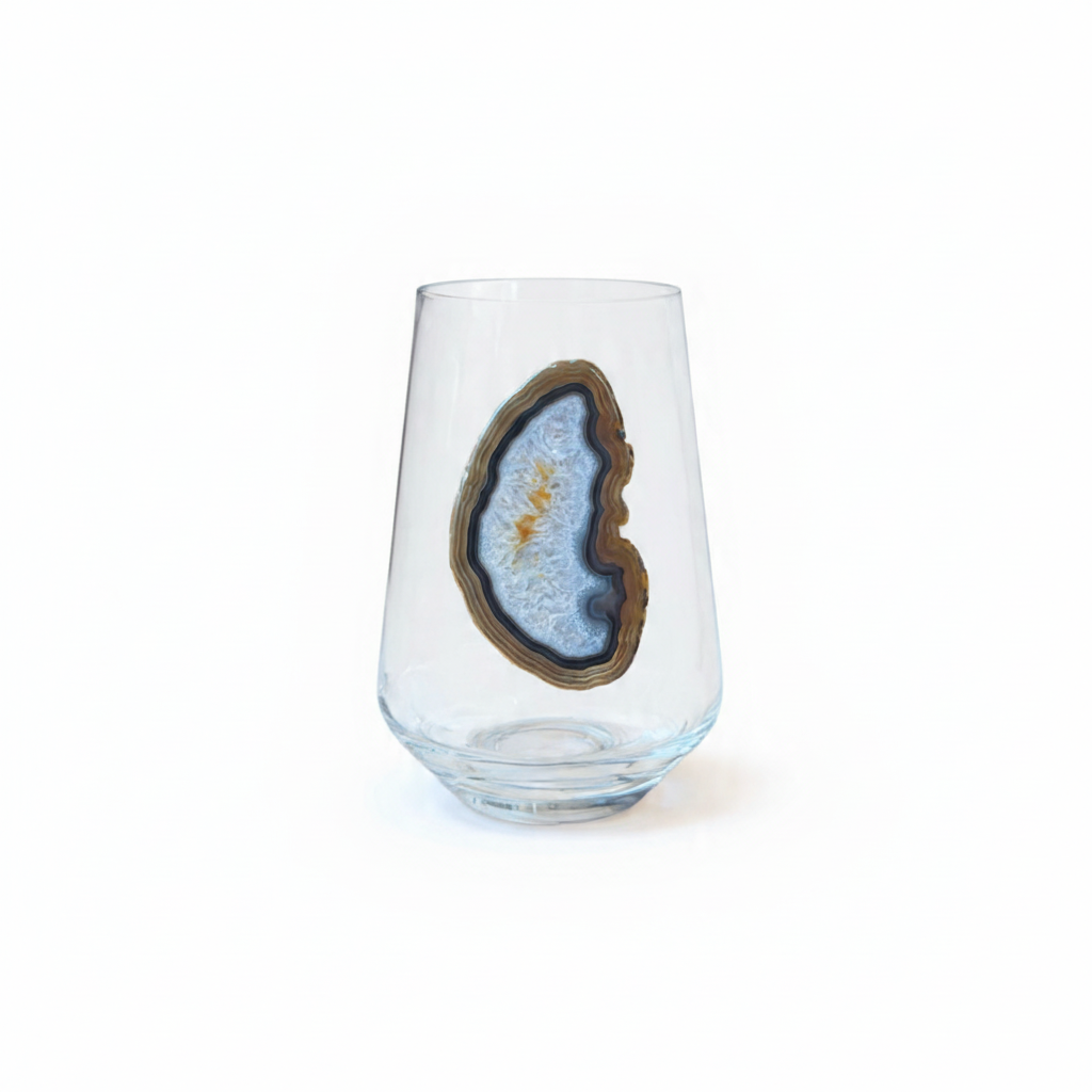 Crystal stemless wineglass affixed with natural geode.