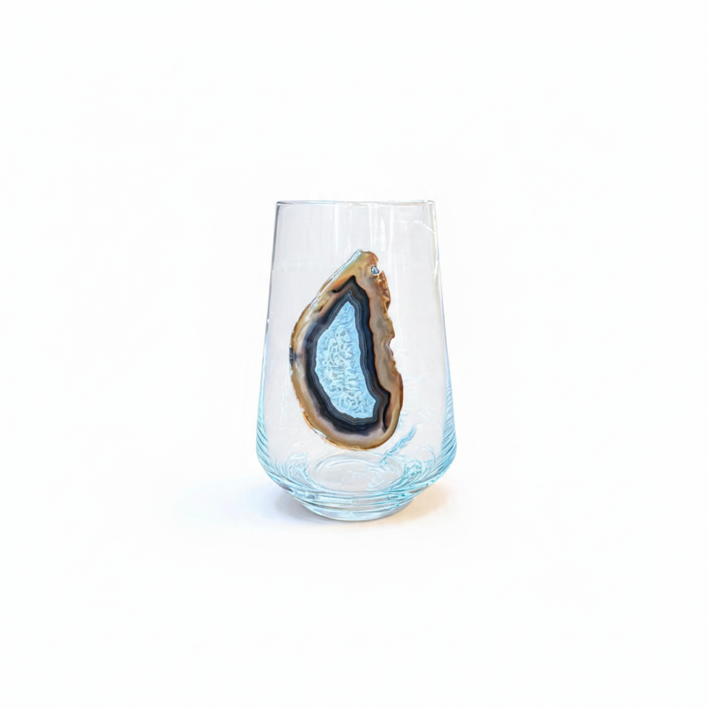 Crystal stemless wineglass affixed with natural geode.