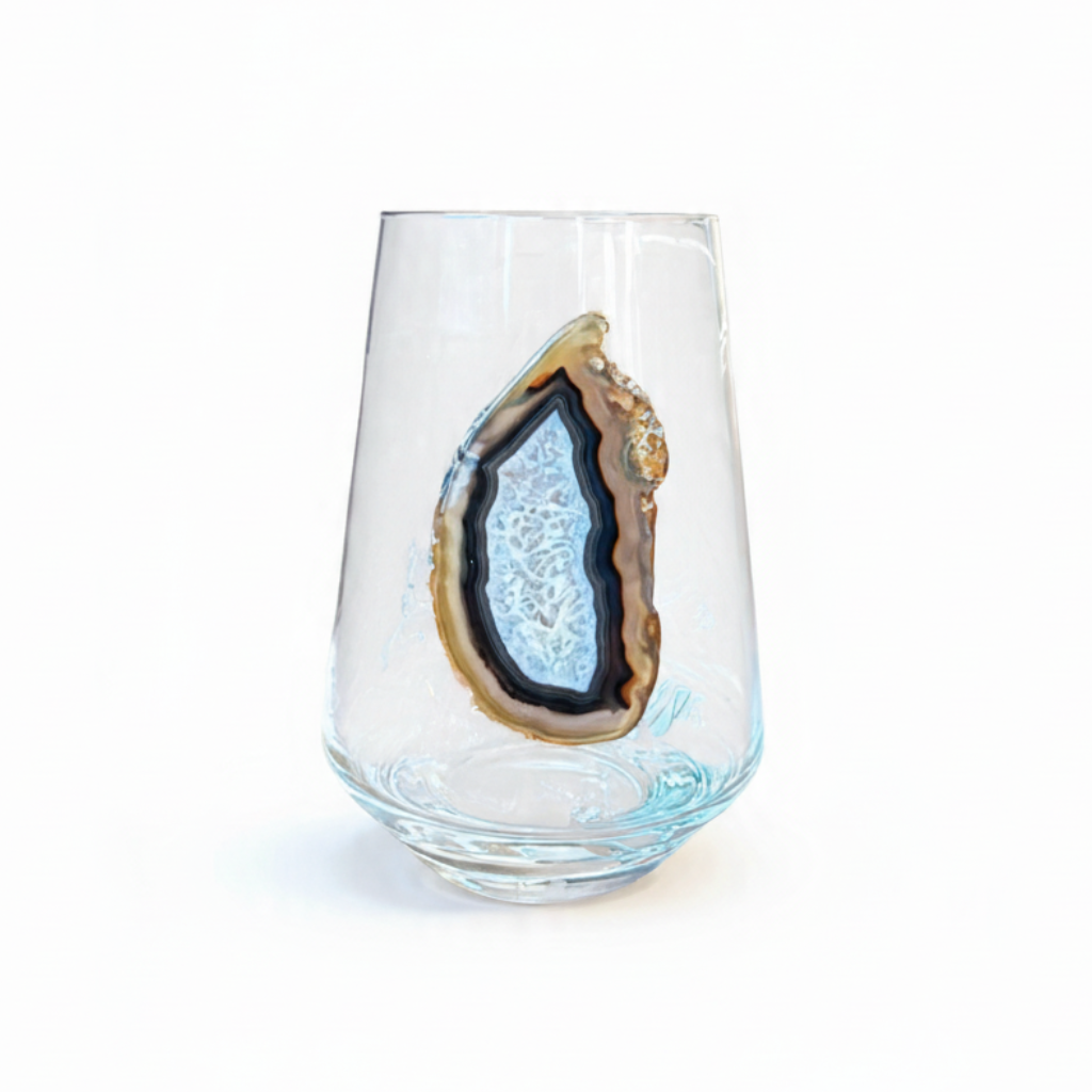 Crystal stemless wineglass affixed with natural geode.